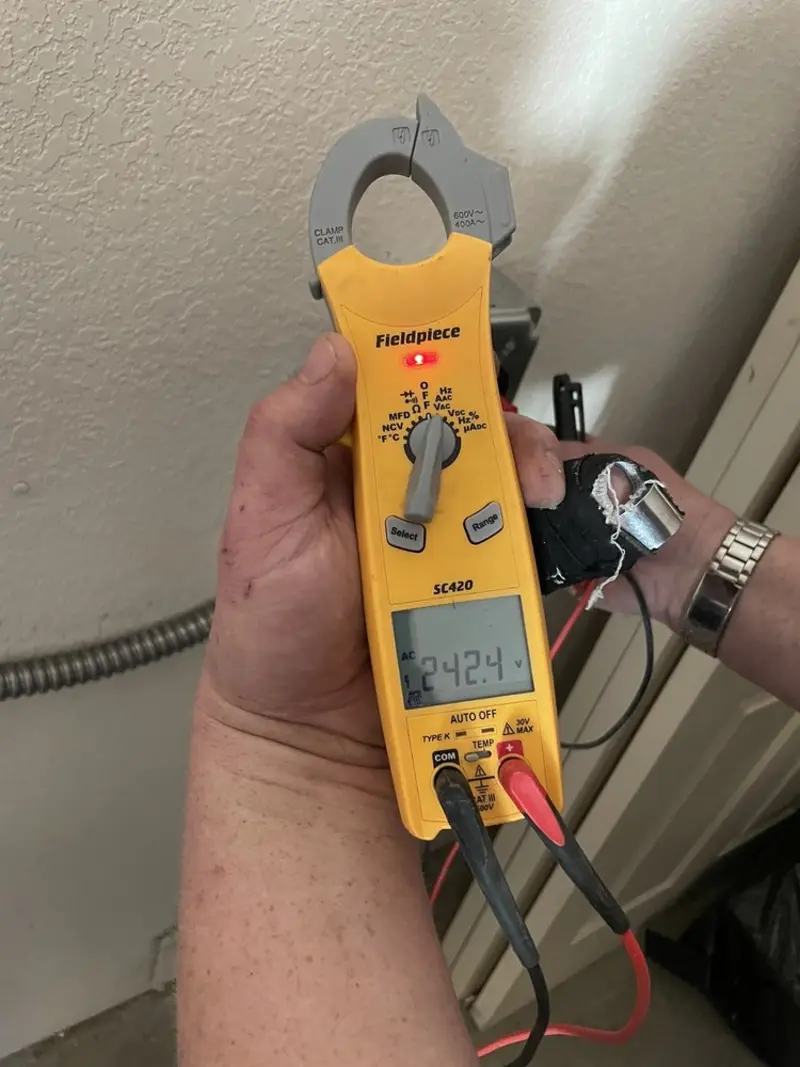Voltage testing with clamp meter during Aluminum Wiring Replacement in The Woodlands